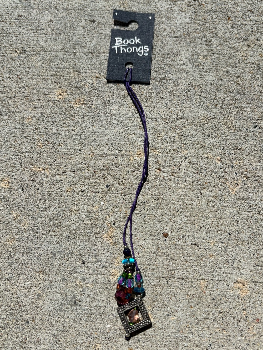 CHARMED BOOK THONG BOOKMARK